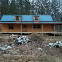Cabin with front and side porch