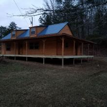 Cabin with front and side porch